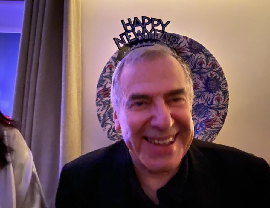 a man wearing a headband that says happy new year