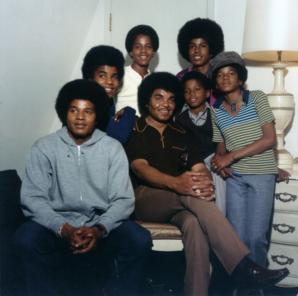 a group of young men are posing for a picture