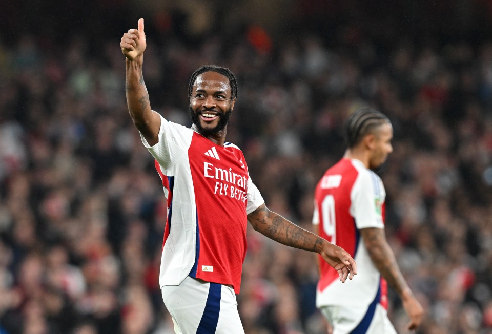 Sterling was all smiles in Arsenal red