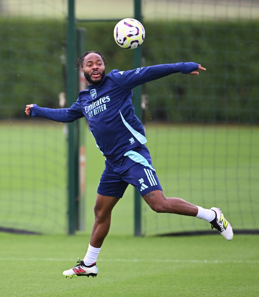 a soccer player wearing a shirt that says emirates fly better