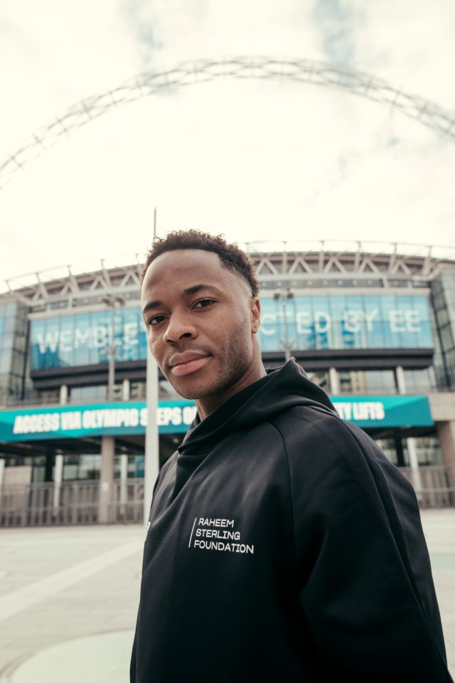 a man wearing a black hoodie that says " raheem abdul jabbar foundation "