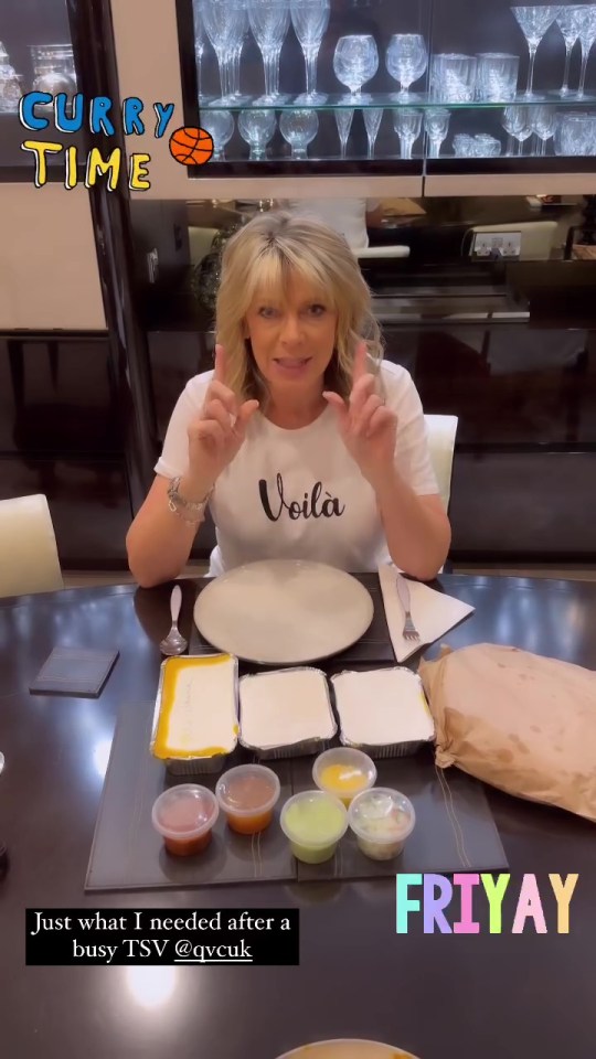 a woman is sitting at a table with a plate of food and a sign that says fri yay