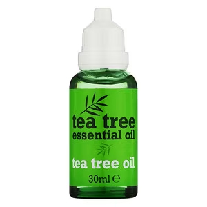 a green bottle of tea tree essential oil