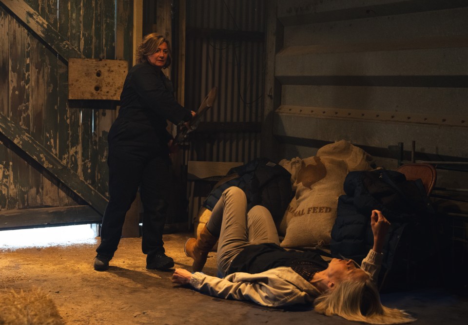 a woman laying on the floor next to a bag that says animal feed