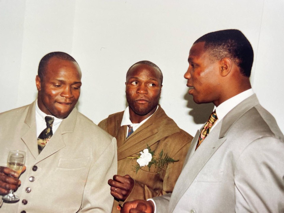 three men in suits and ties are standing next to each other