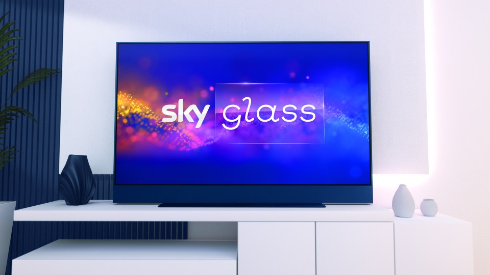 a flat screen tv displays the sky glass logo