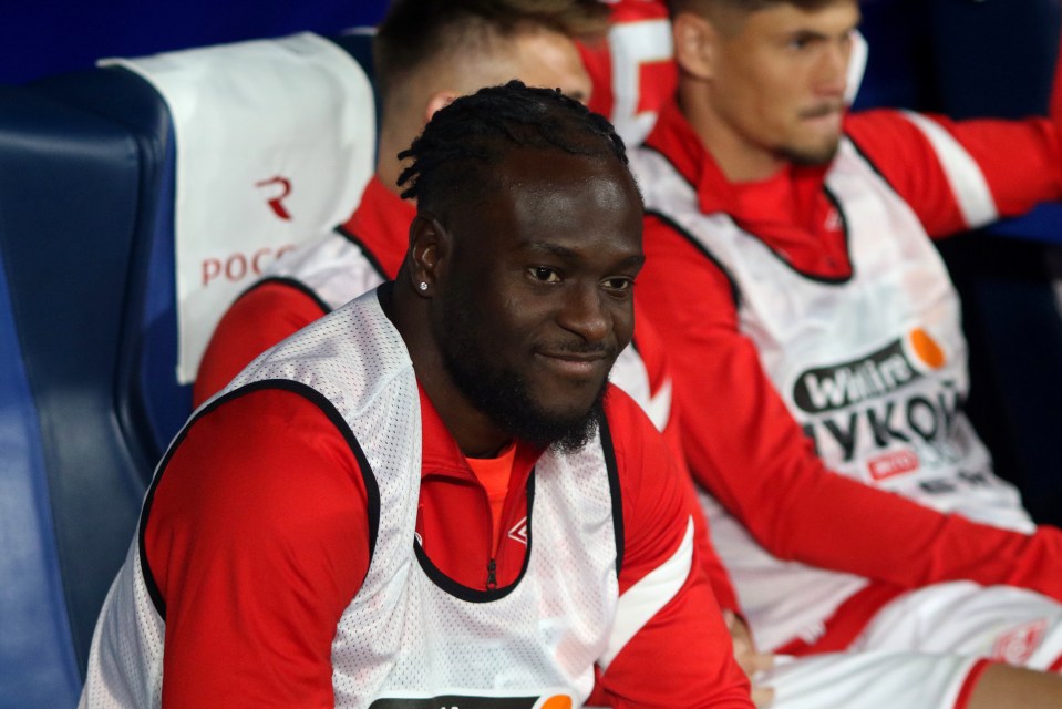 a soccer player wearing a vest that says win