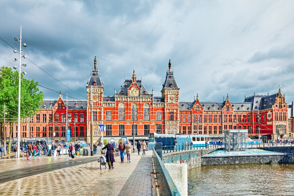 a large red building with a clock on top of it