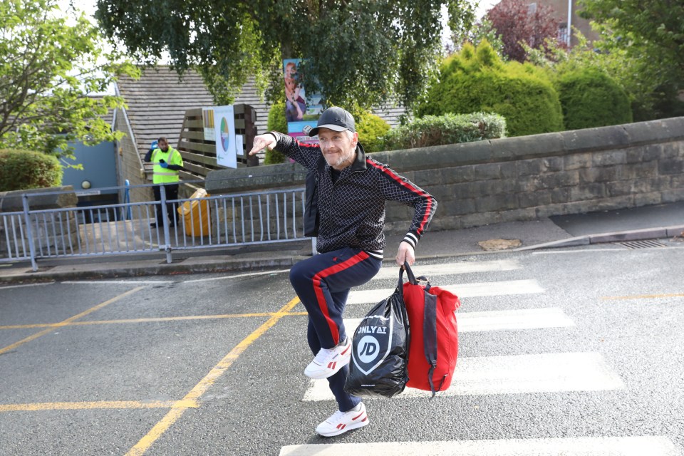 a man carrying a bag that says royal on it