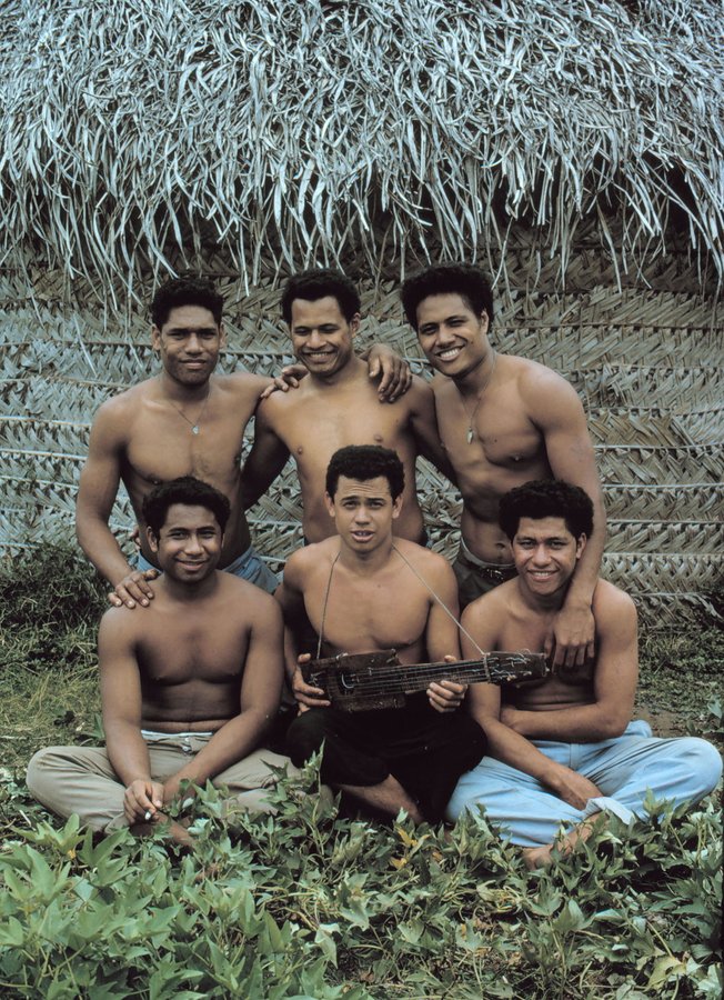 a group of shirtless men are posing for a picture