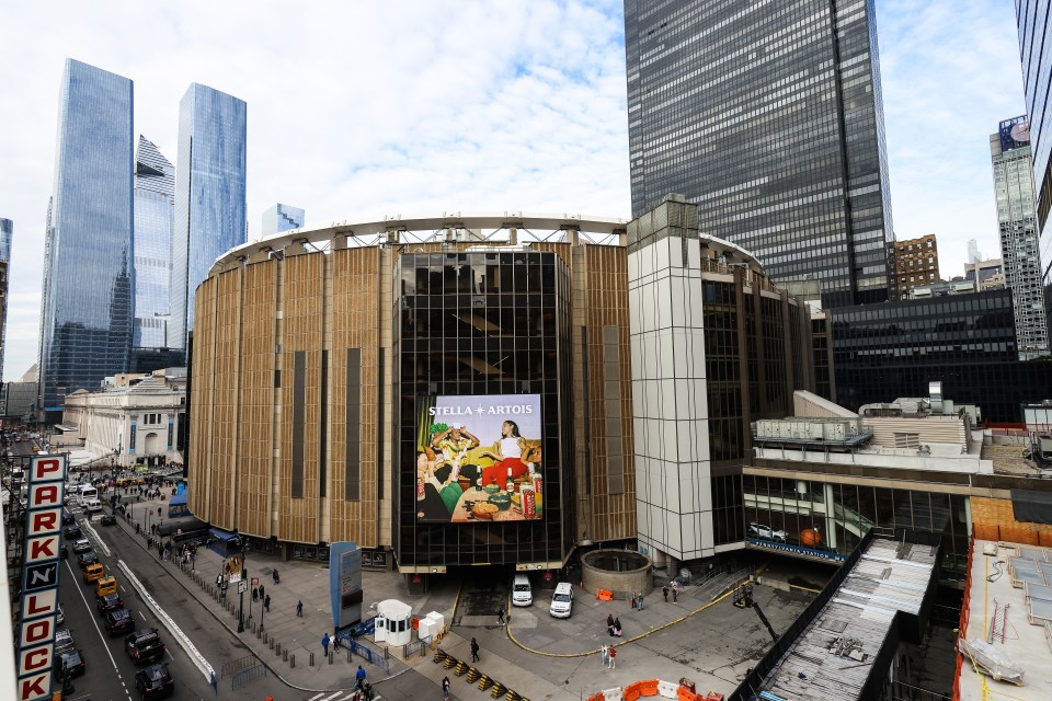 a large stella artois advertisement is on the side of a building