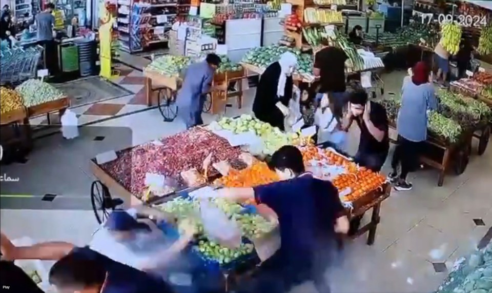 The shopper is knocked onto the ground by the detonation