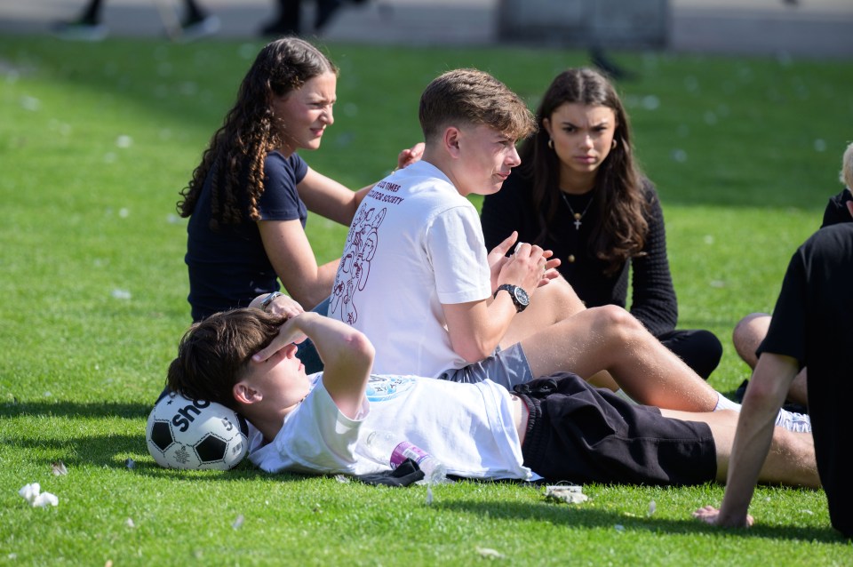 Pals relax in in Glasgow’s George Square earlier this month