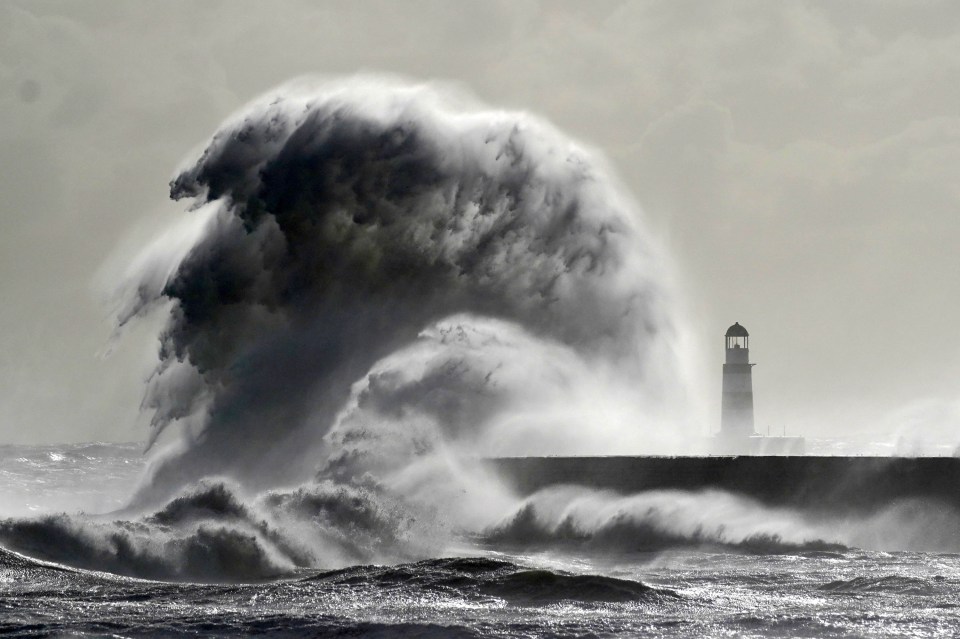 a lighthouse in the middle of a stormy ocean