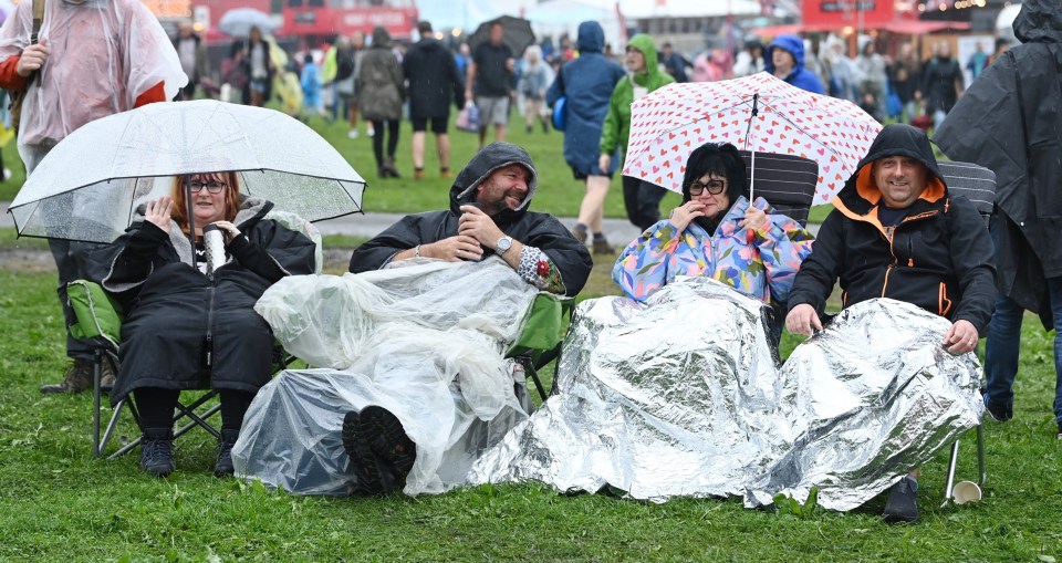 Brits had been experiencing wet and miserable conditions just days ago, such as these revellers at the Radio 2 In The Park in Preston