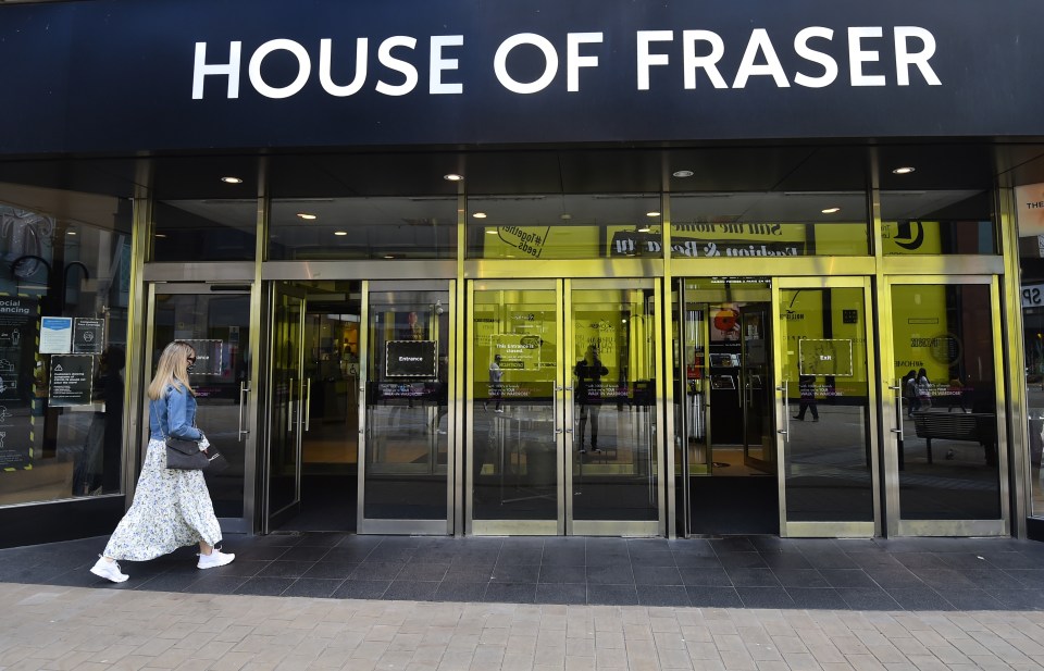 a woman walks into the house of fraser store