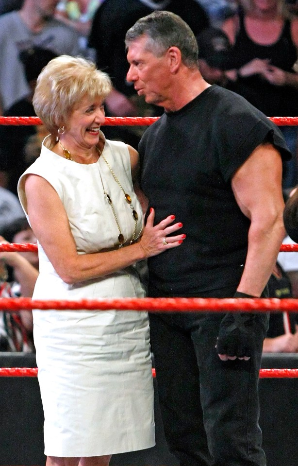 Linda McMahon and her husband in the ring during Vince's 64th birthday