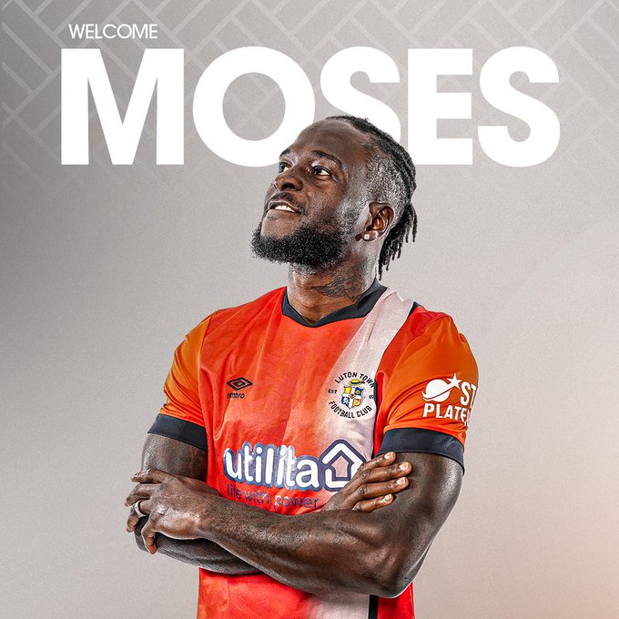 a man wearing an orange jersey with the word moses on it