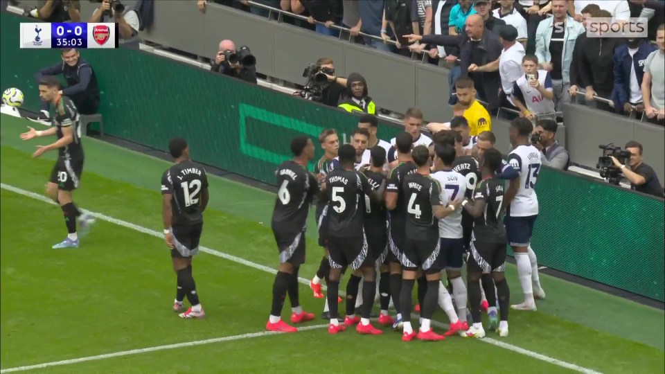 Arsenal and Tottenham players clashed during the first half of the North London derby