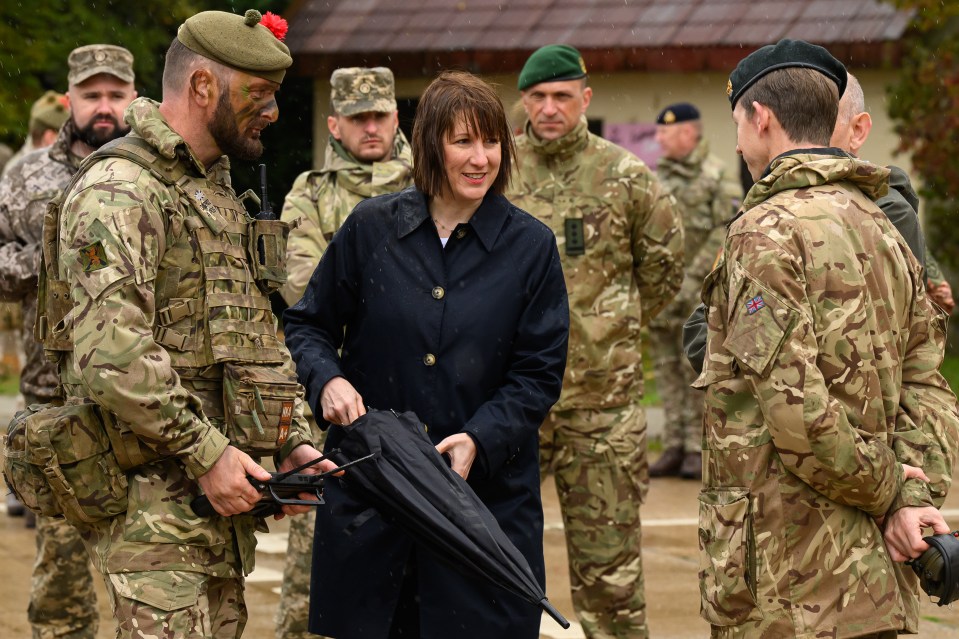 a group of soldiers are standing around a woman holding an umbrella