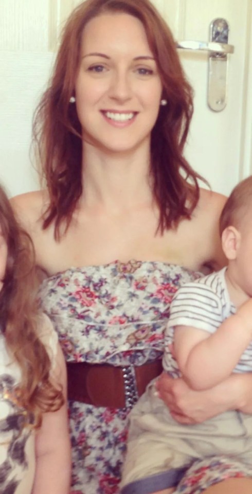 a woman in a floral dress is holding a baby