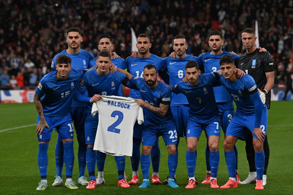 the greek soccer team poses for a photo