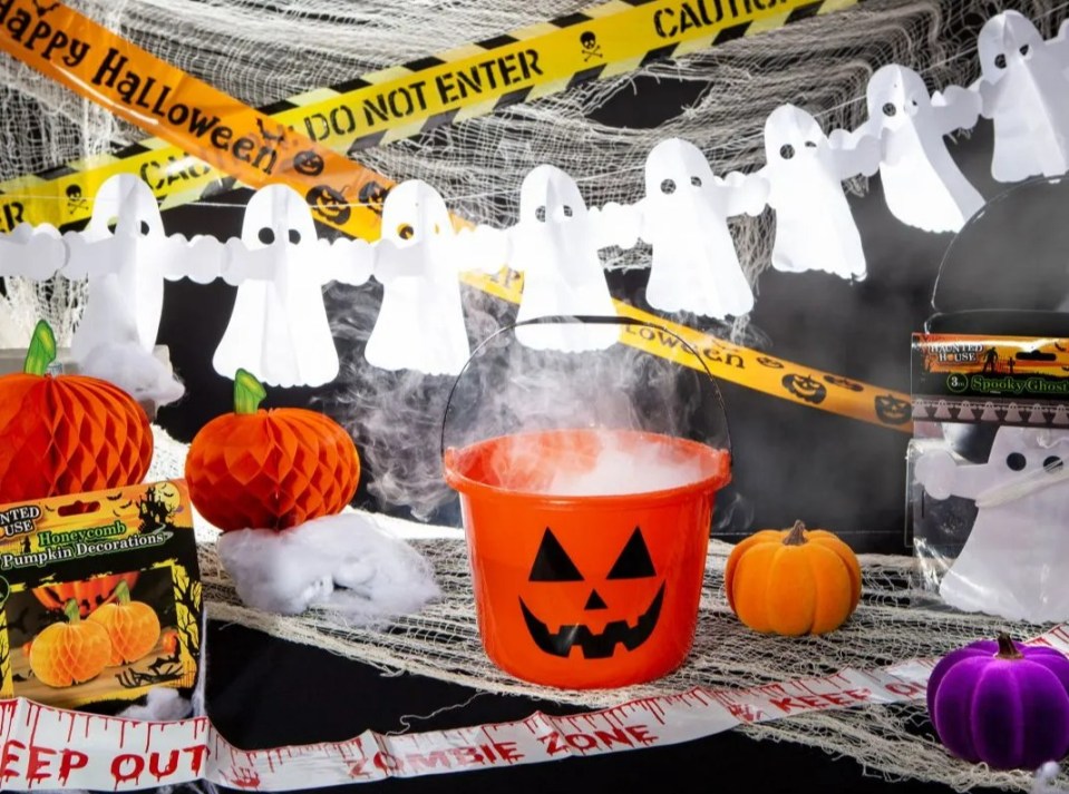 halloween decorations including a bucket with smoke coming out of it