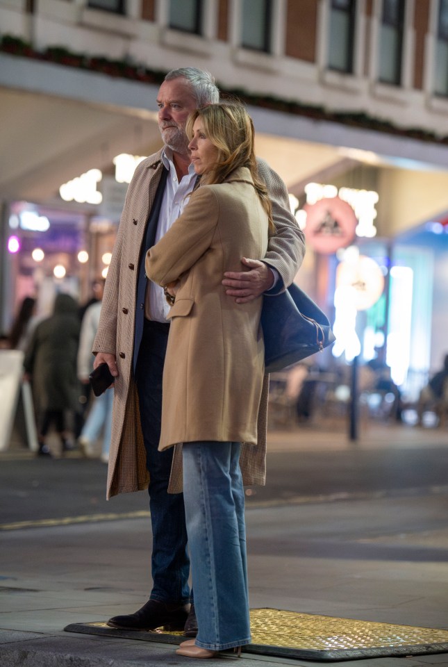 He was also pictured with his arm around her in central London