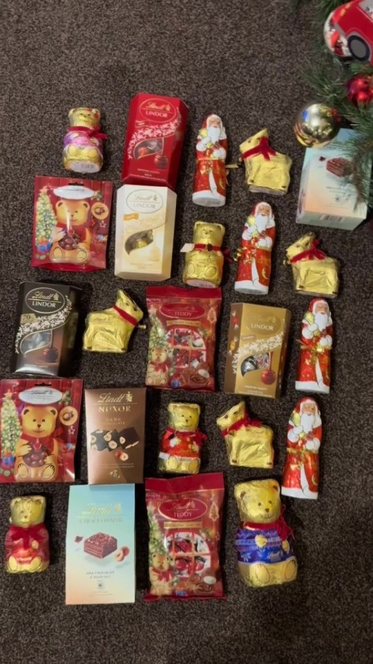 a variety of lindt chocolates are laid out on the floor