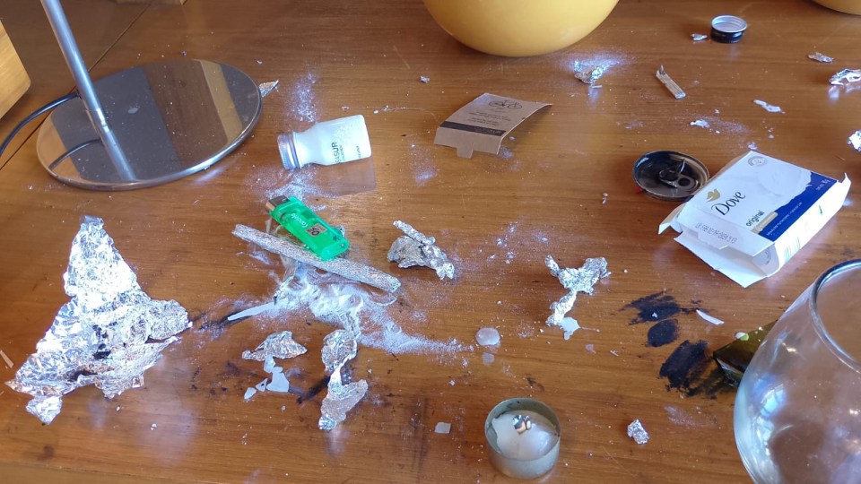 a box of dove soap sits on a messy table