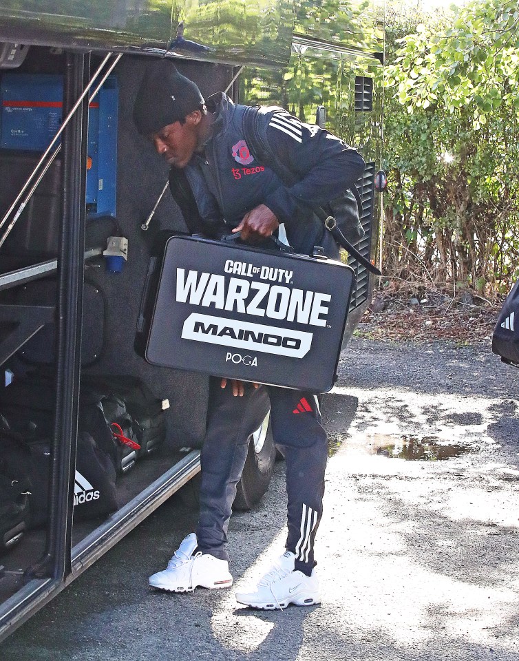 a man carrying a case that says call of duty warzone