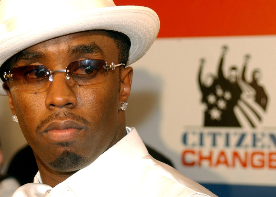 a man wearing sunglasses and a hat stands in front of a citizen change sign