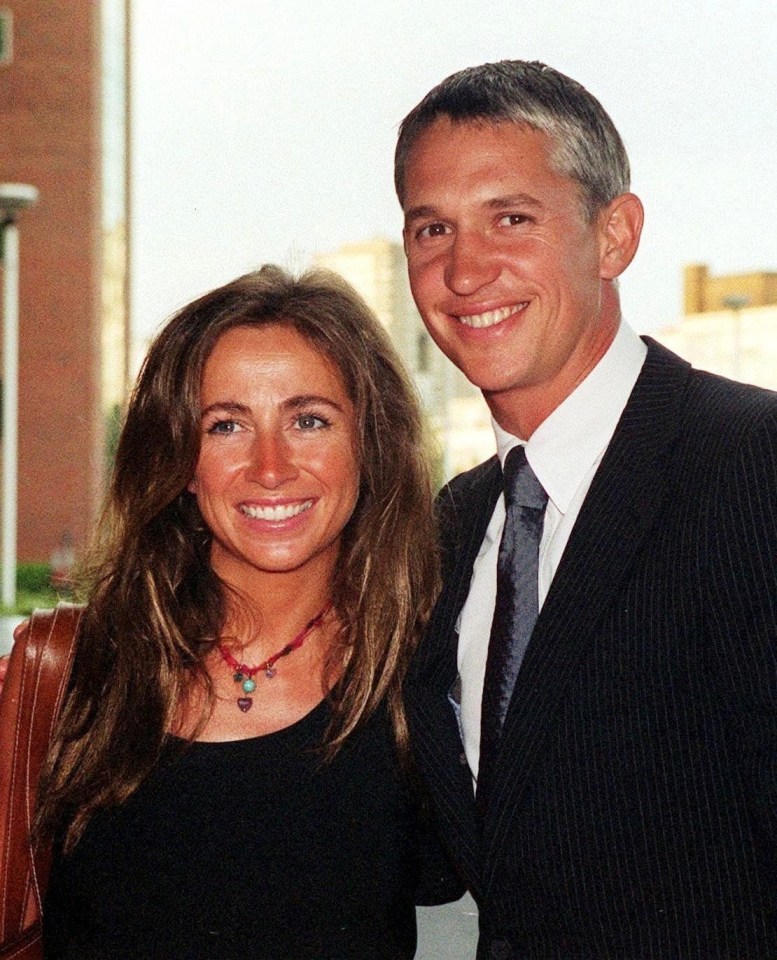 a man and a woman are posing for a picture and smiling