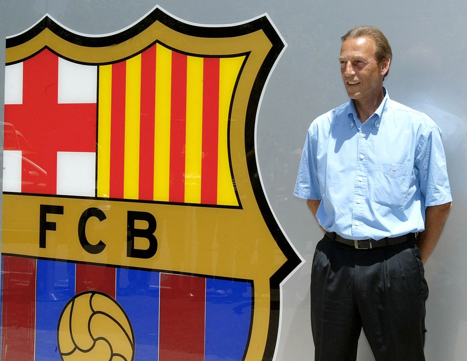 a man stands in front of a fcb logo