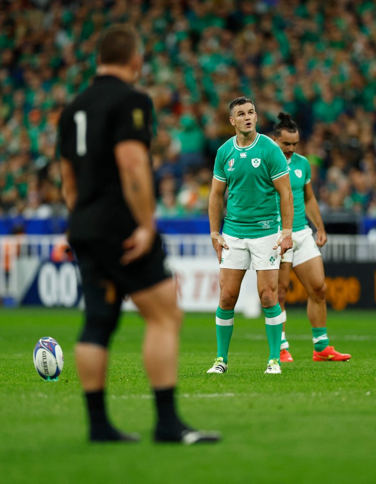 a rugby player in a green jersey with the number 1 on it