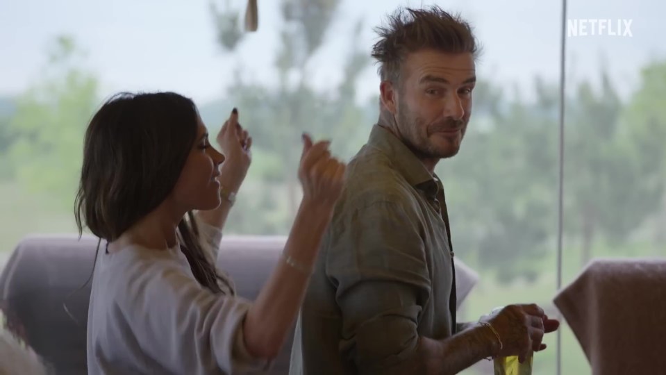 a man and a woman are dancing in front of a netflix logo