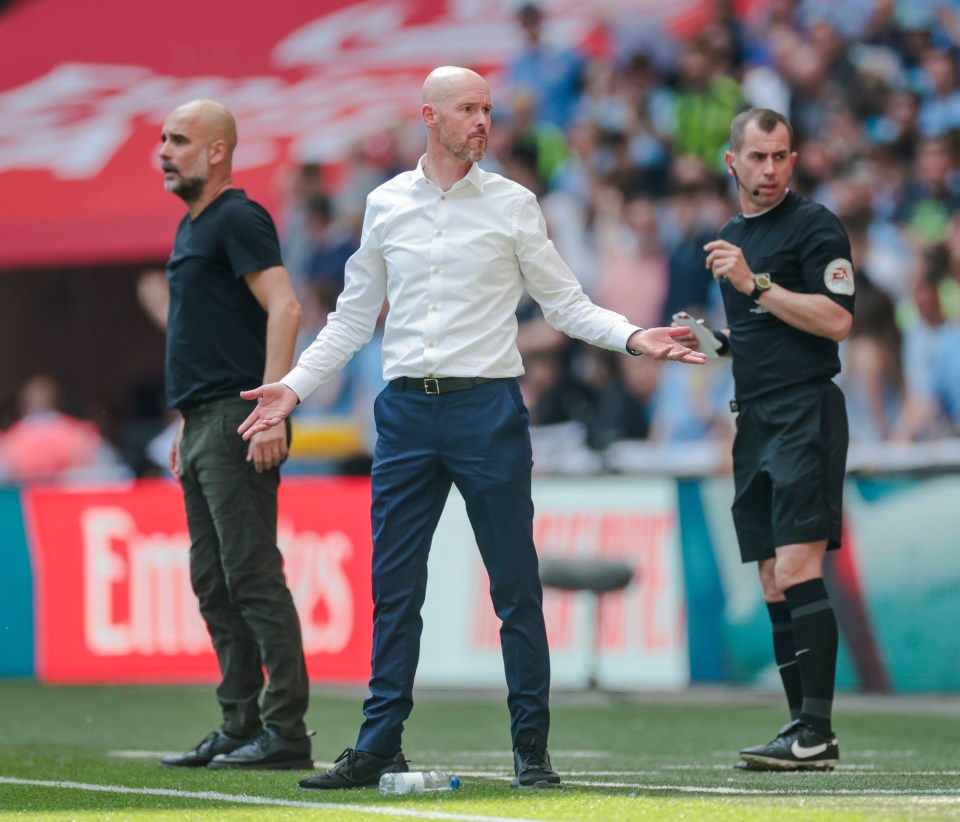 three men on a soccer field with an emirates advertisement in the background