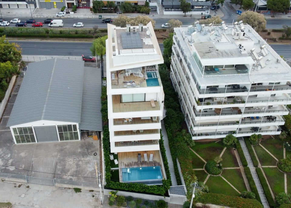 a building with a swimming pool on the top of it