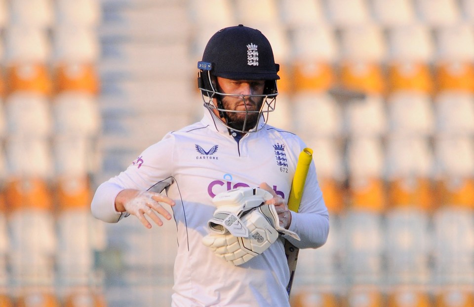 a cricket player wearing a white shirt that says castore on it