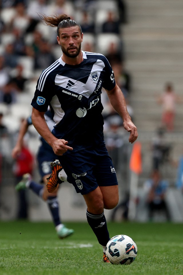 a soccer player wearing a jersey that says burger king on it