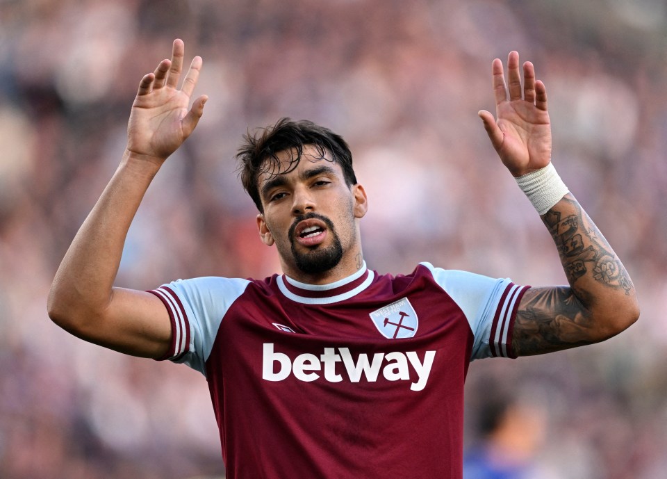 a soccer player wearing a maroon jersey that says ' betway ' on it