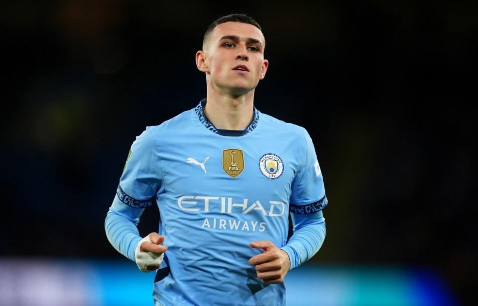 a soccer player wearing a blue etihad airways jersey