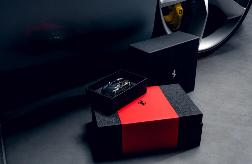 The car is complemented by a suite of accessories, including a Berluti carbon fibre helmet and accompanying leather carry case