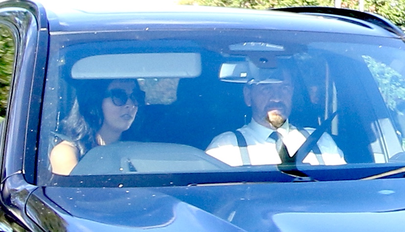 a man and a woman are sitting in a car