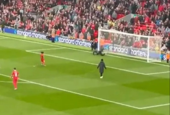 a soccer field with a banner that says standard chartered