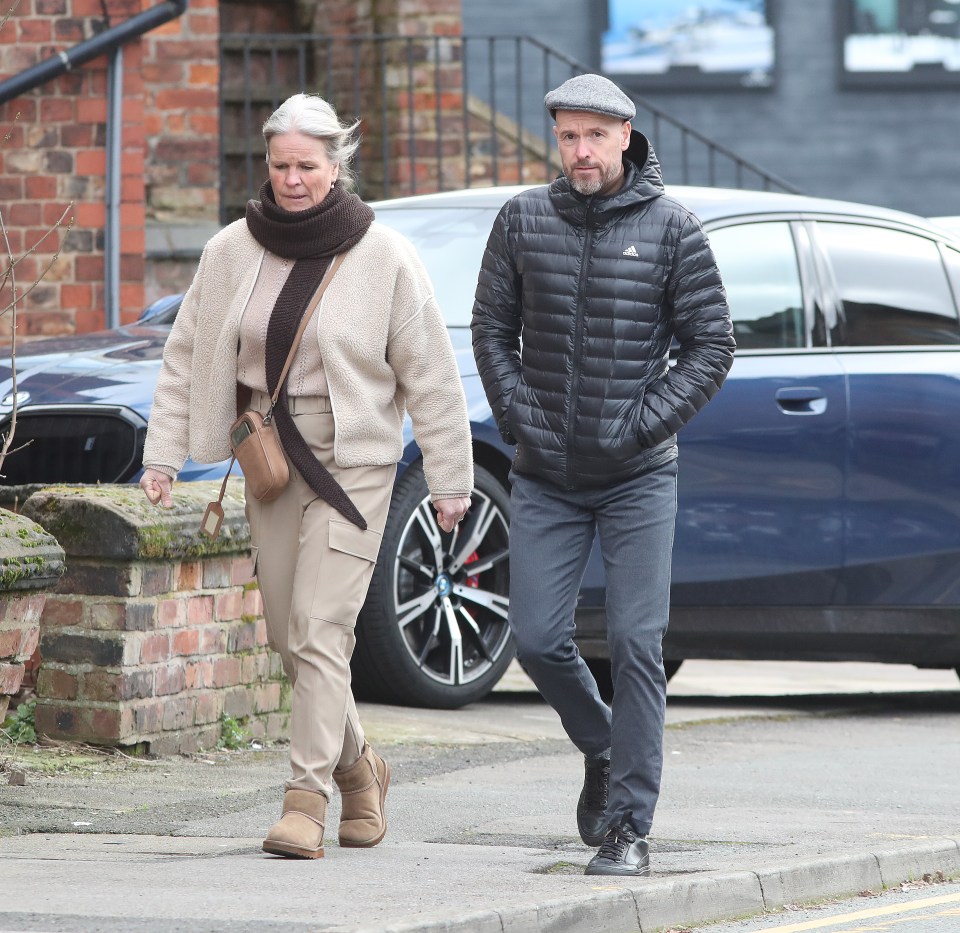 a man wearing an adidas jacket walks with a woman