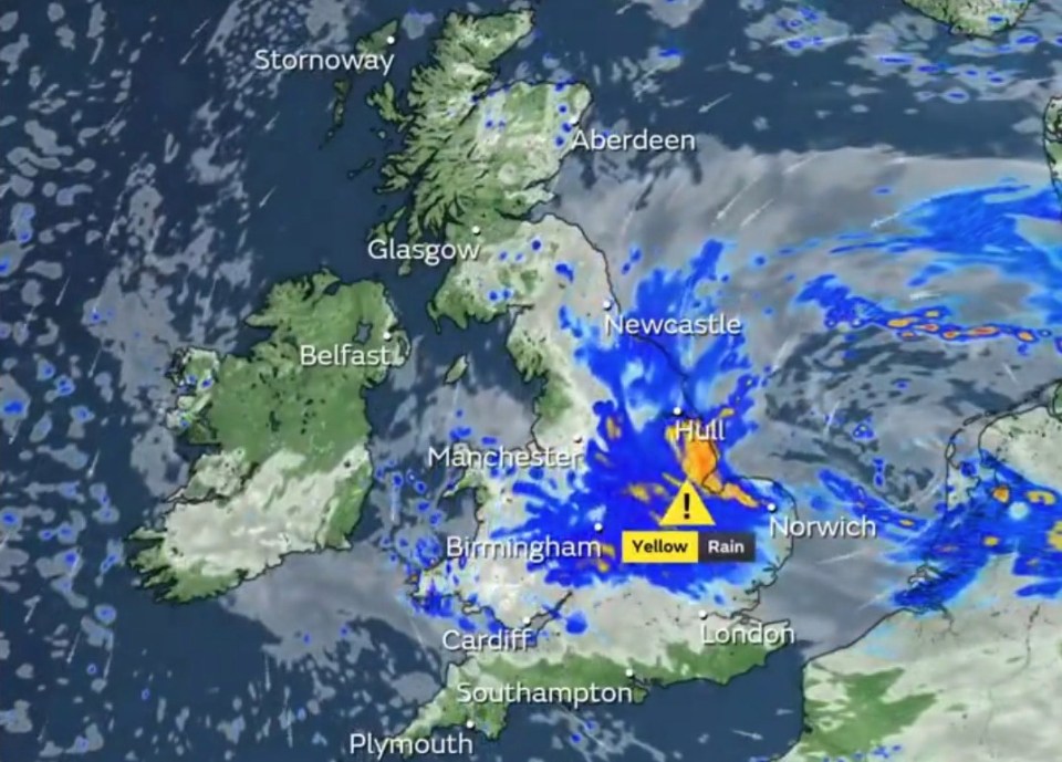 a map of the united kingdom shows a yellow rain warning