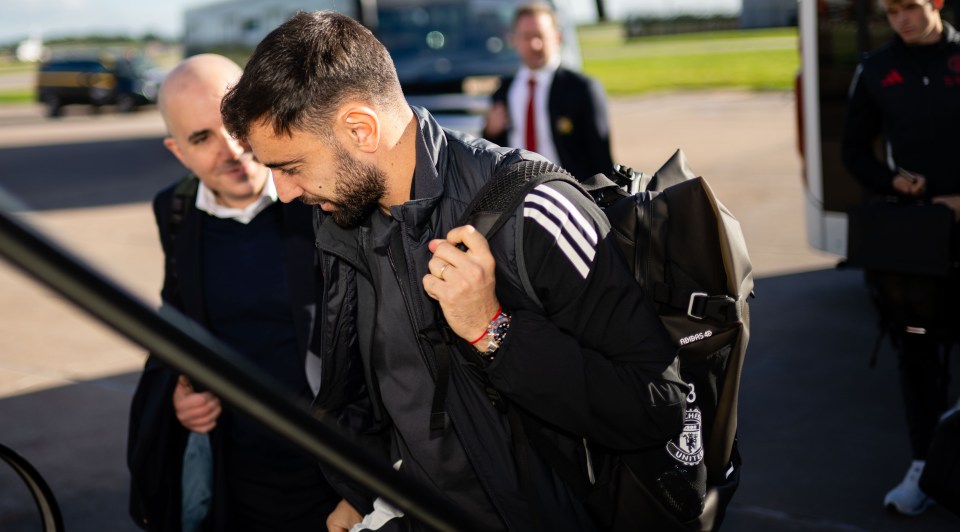 a man carrying a bag that says adidas on it