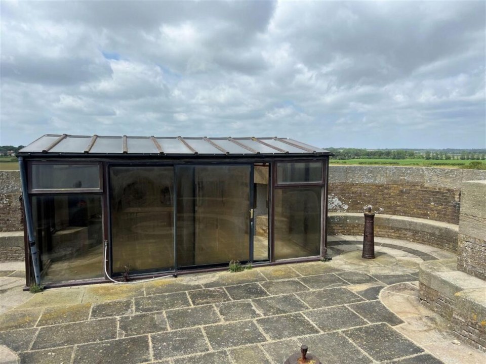 a building with a lot of windows and a roof