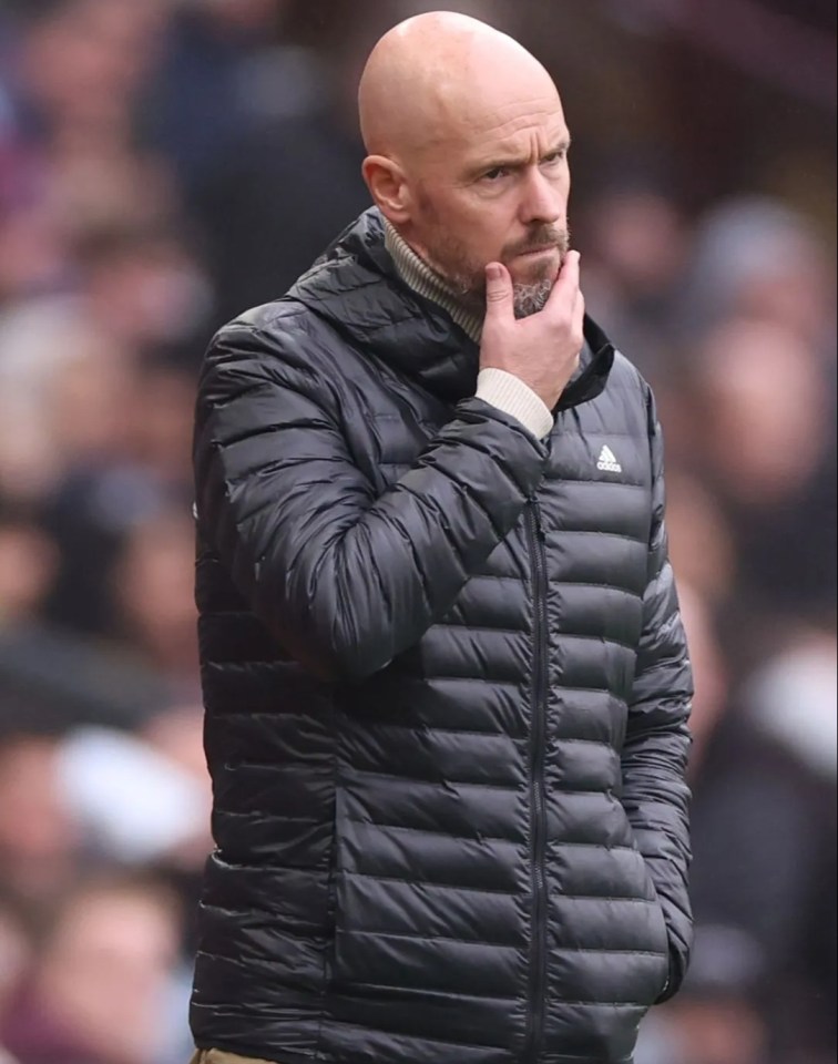 a bald man wearing a black adidas jacket